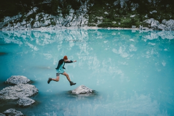 Jumping around alpine lakes in the Dolomites, Italy.
